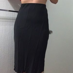 tighter fitting black skirt - silky - worn a few times, still new condition
